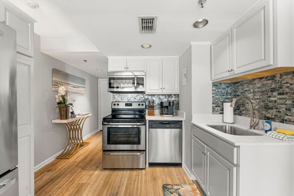 Fully Stocked Kitchen with Ocean Views, Stainless Steel Appliances and Bar Seating