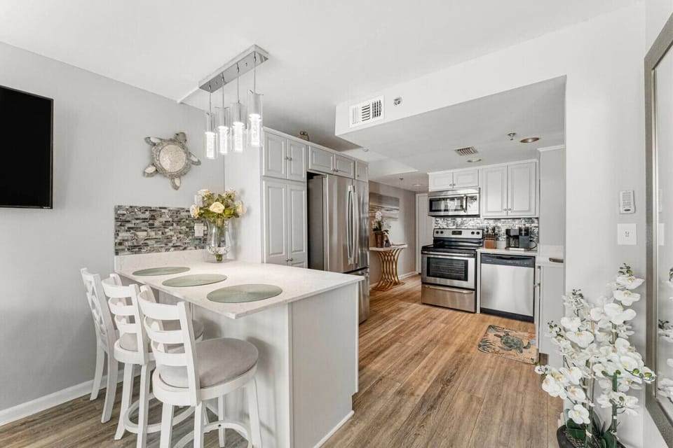 Fully Stocked Kitchen with Ocean Views, Stainless Steel Appliances and Bar Seating