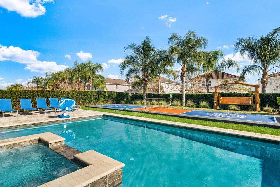 - Private pool with crystal clear water and relaxing spa hot tub  
- Outdoor lounge chairs for sunbathing and family poolside fun  
- Basketball hoop adds extra entertainment in the swimming pool
- Private pickleball court!