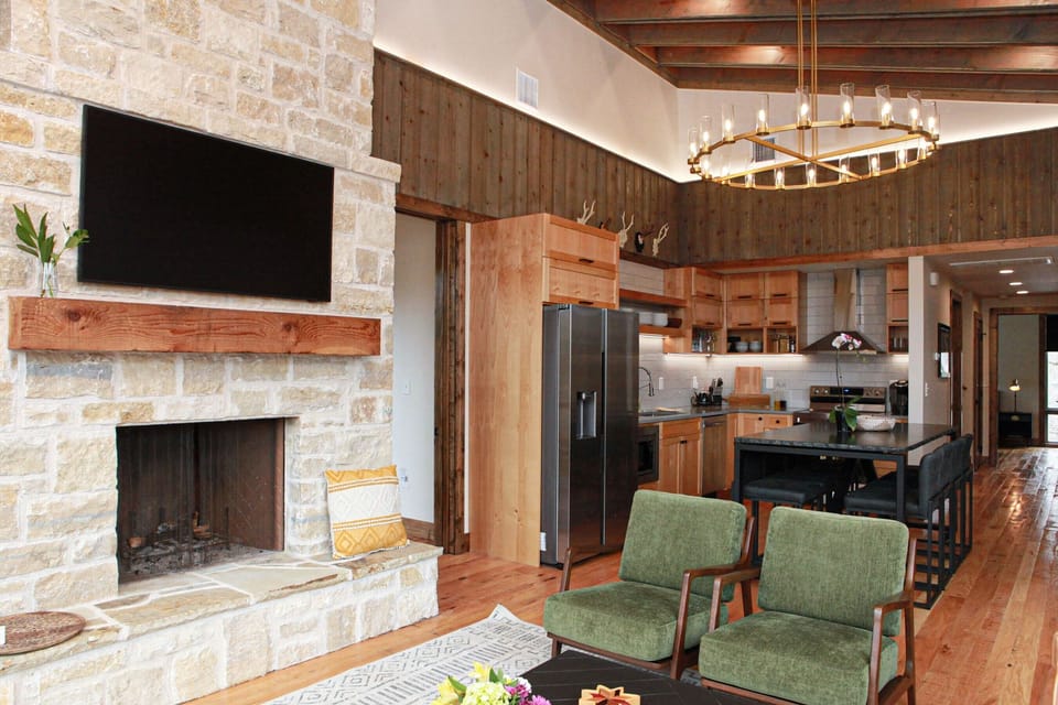 Fireplace/Smart TV looking into the dining and kitchen area