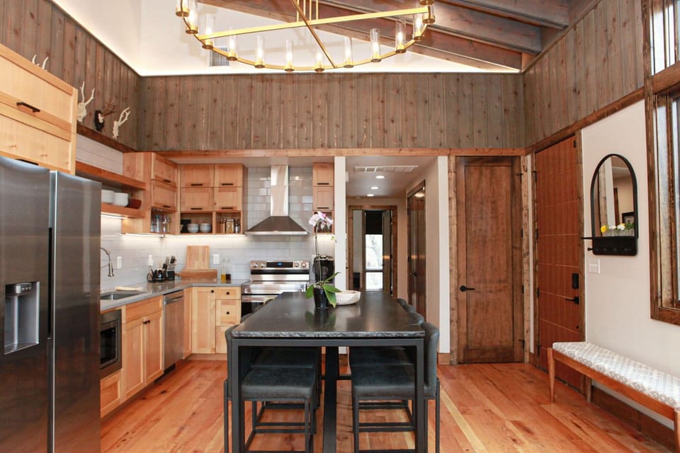 Dining and kitchen area equipped with Keurig coffee maker with K-Cups provided
