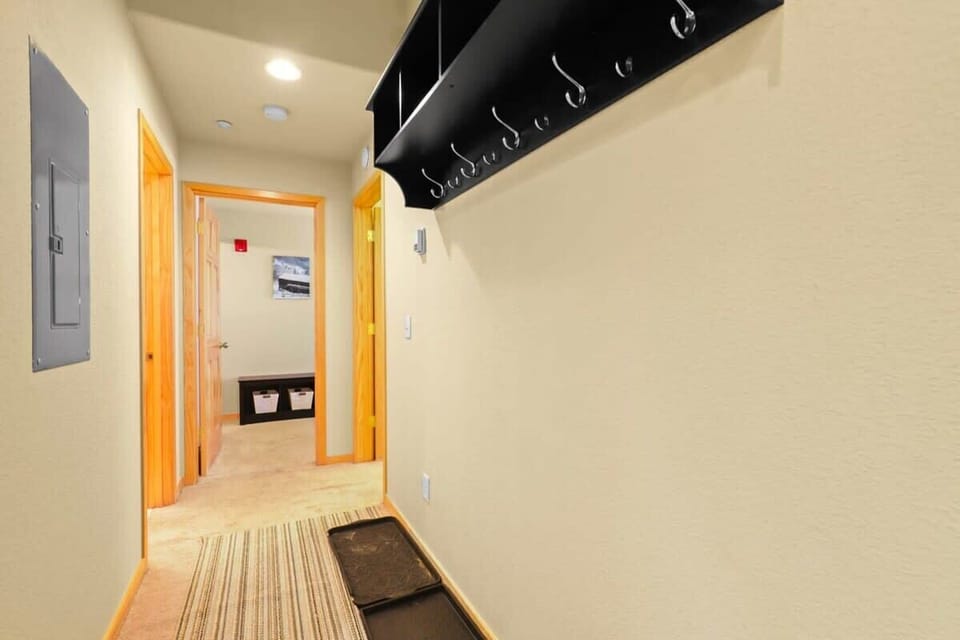 The view down the hallway towards the bedrooms where you will find space to store your outdoor gear.