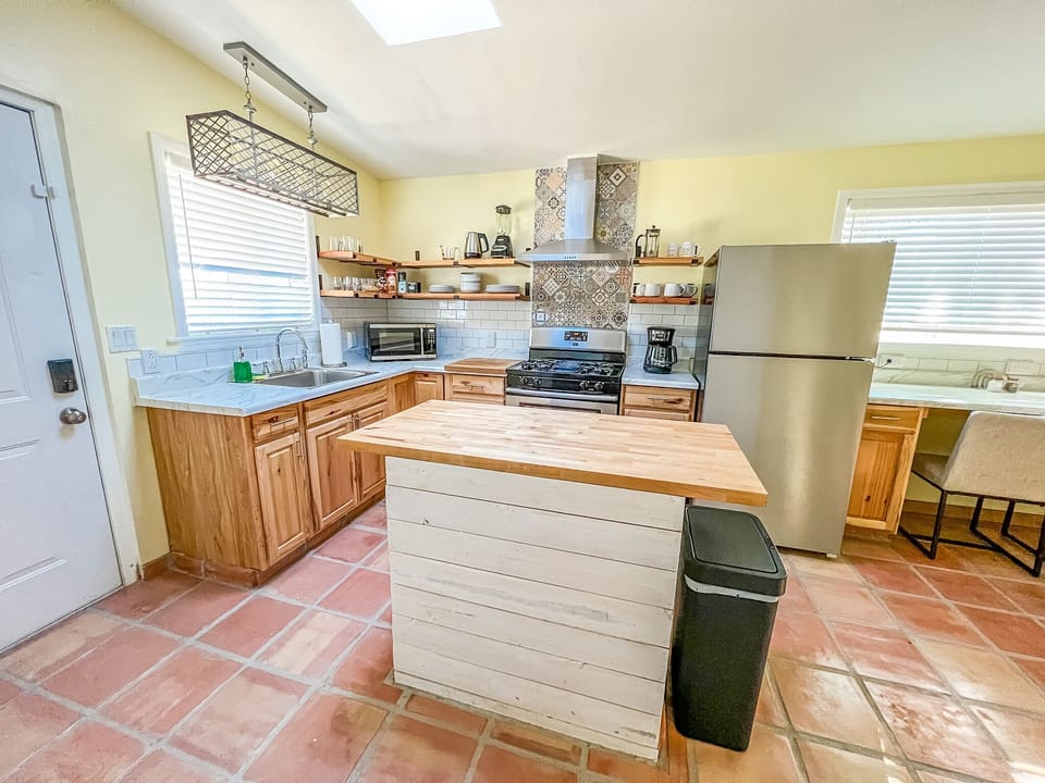 Full-size appliances and kitchen equipped with everything you need to cook with.