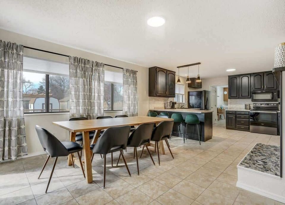 Our dining area, next to the kitchen, provides the utmost convenience. Enjoy your meals in beautiful natural light from large windows at Evergreen Luxe.