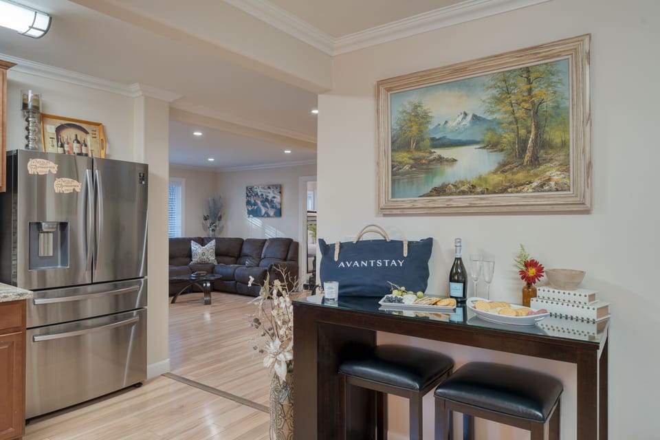 Barstool sitting area near the entrance to the kitchen.