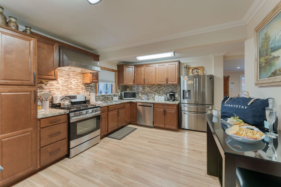 Fully equipped kitchen with electric appliances.