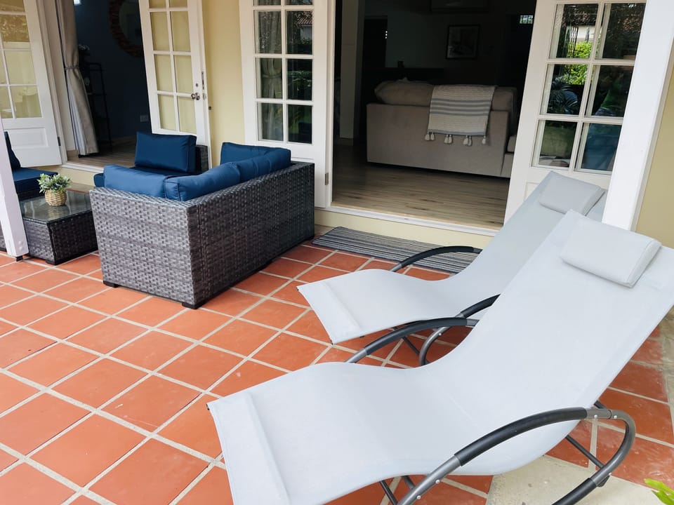 Peaceful patio with 2 sun loungers