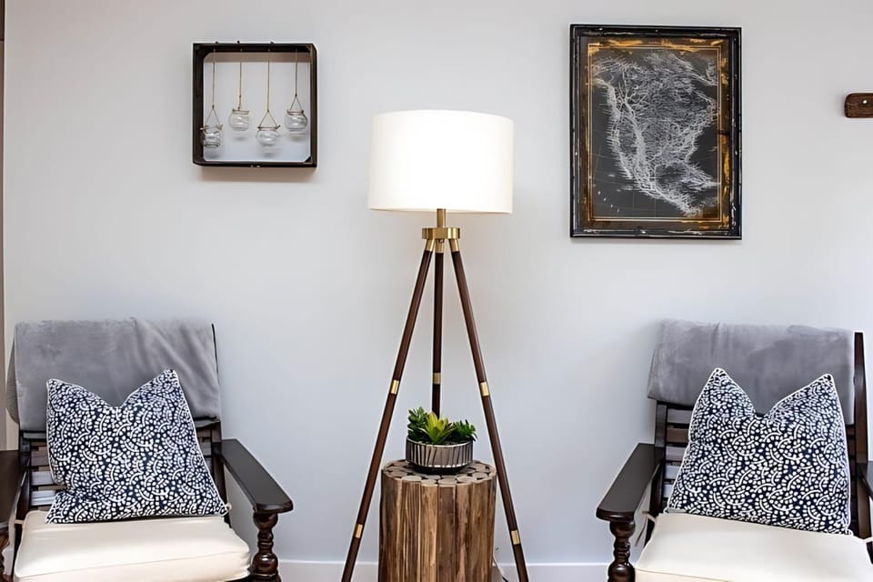 Charming coastal art brings warmth and personality to this inviting room.