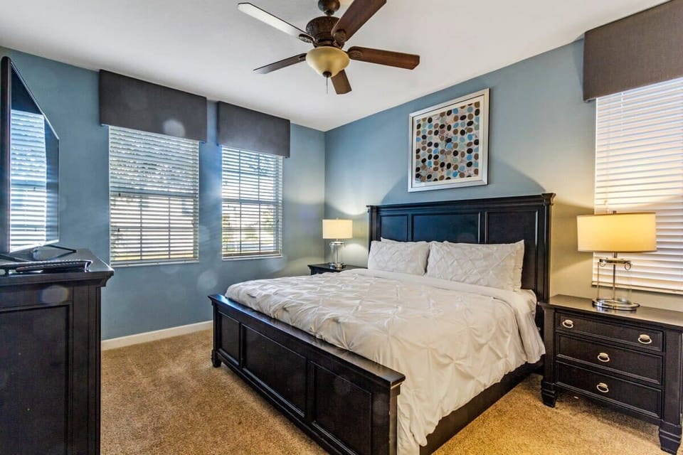 Sink into comfort at the end of the day in this welcoming king bedroom, featuring a plush king bed, flat-screen TV, high-speed Wi-Fi, and a relaxing setting designed for a great night's sleep.