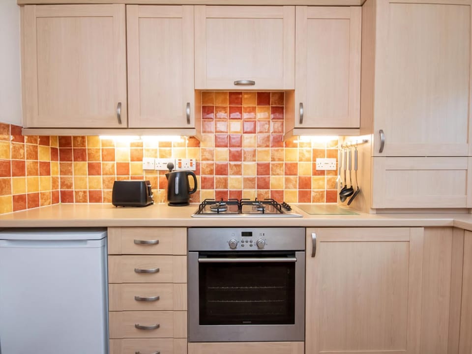 Kitchen | Holm Dell Apartment, Inverness