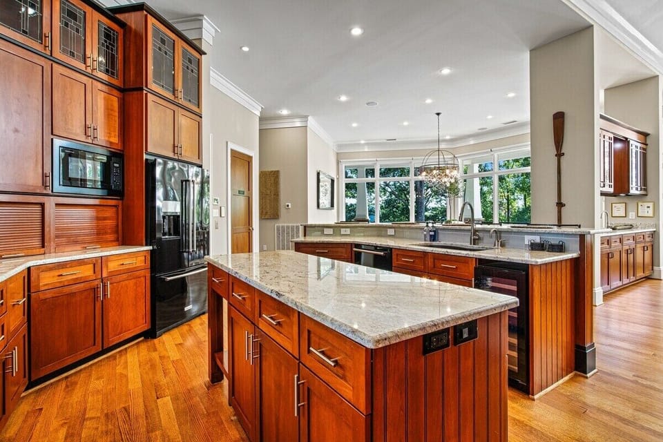Main Level: Gourmet kitchen in this stunning vacation rental, perfect for culinary adventures with natural light.