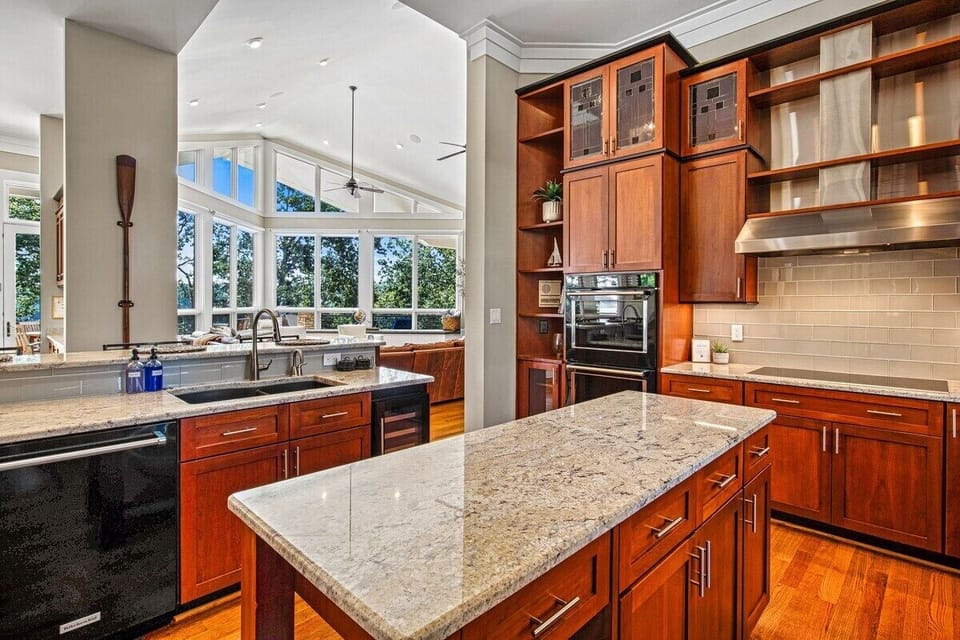 Main Level: Elegant and spacious kitchen at this vacation rental, featuring modern appliances and scenic views.
