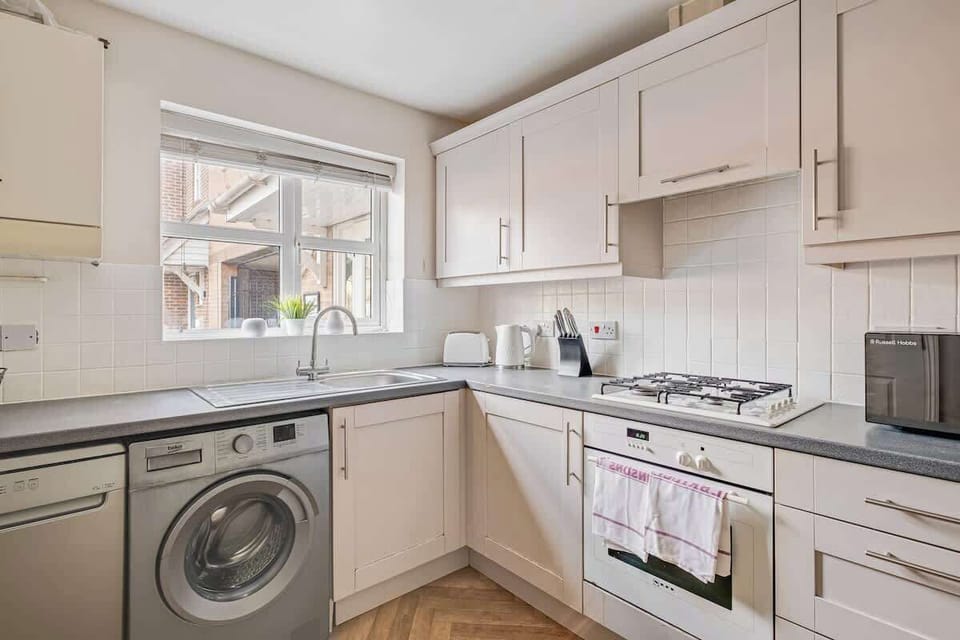 With all the essential facilities, the kitchen offers everything you need, including a washing machine for added convenience