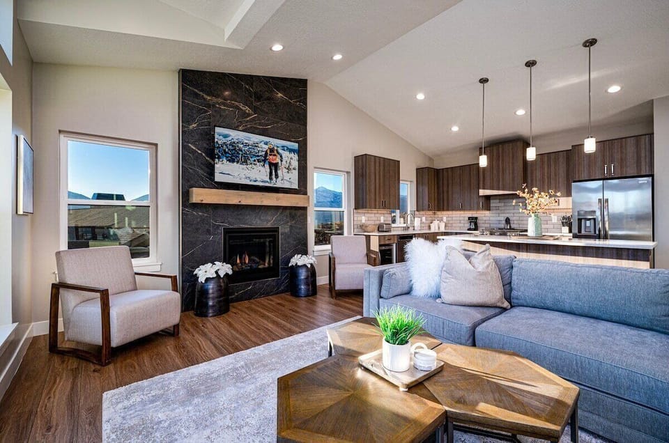 The open-concept living space, complete with a dining area, facilitates effortless conversation with family and friends.