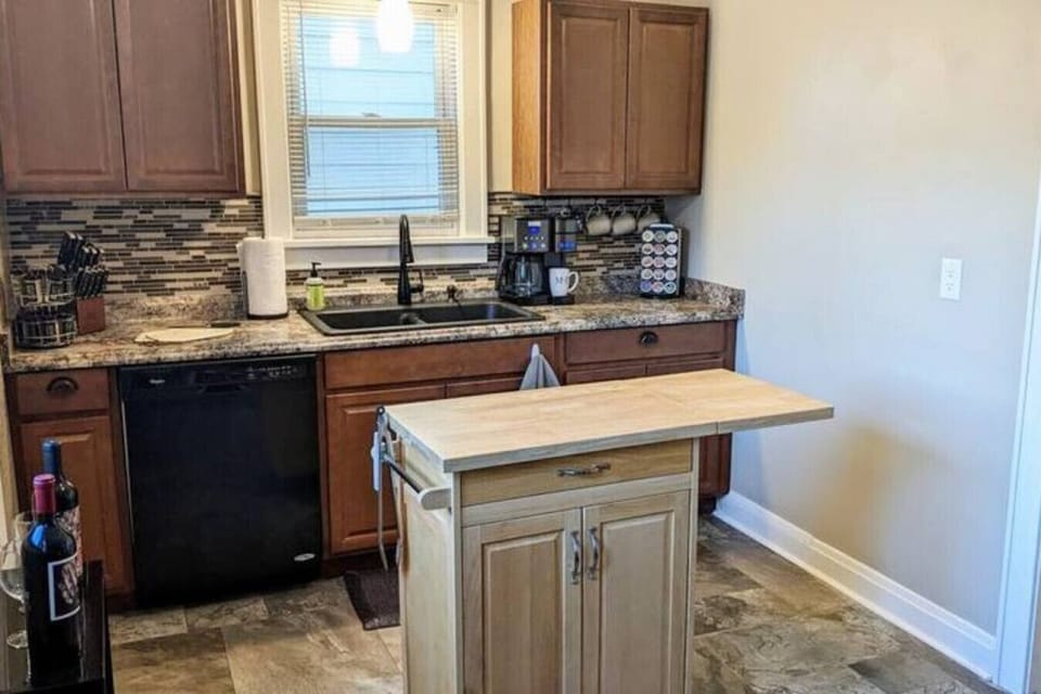 Rolling island extended and moved to the center of the kitchen for an idea of the extra space