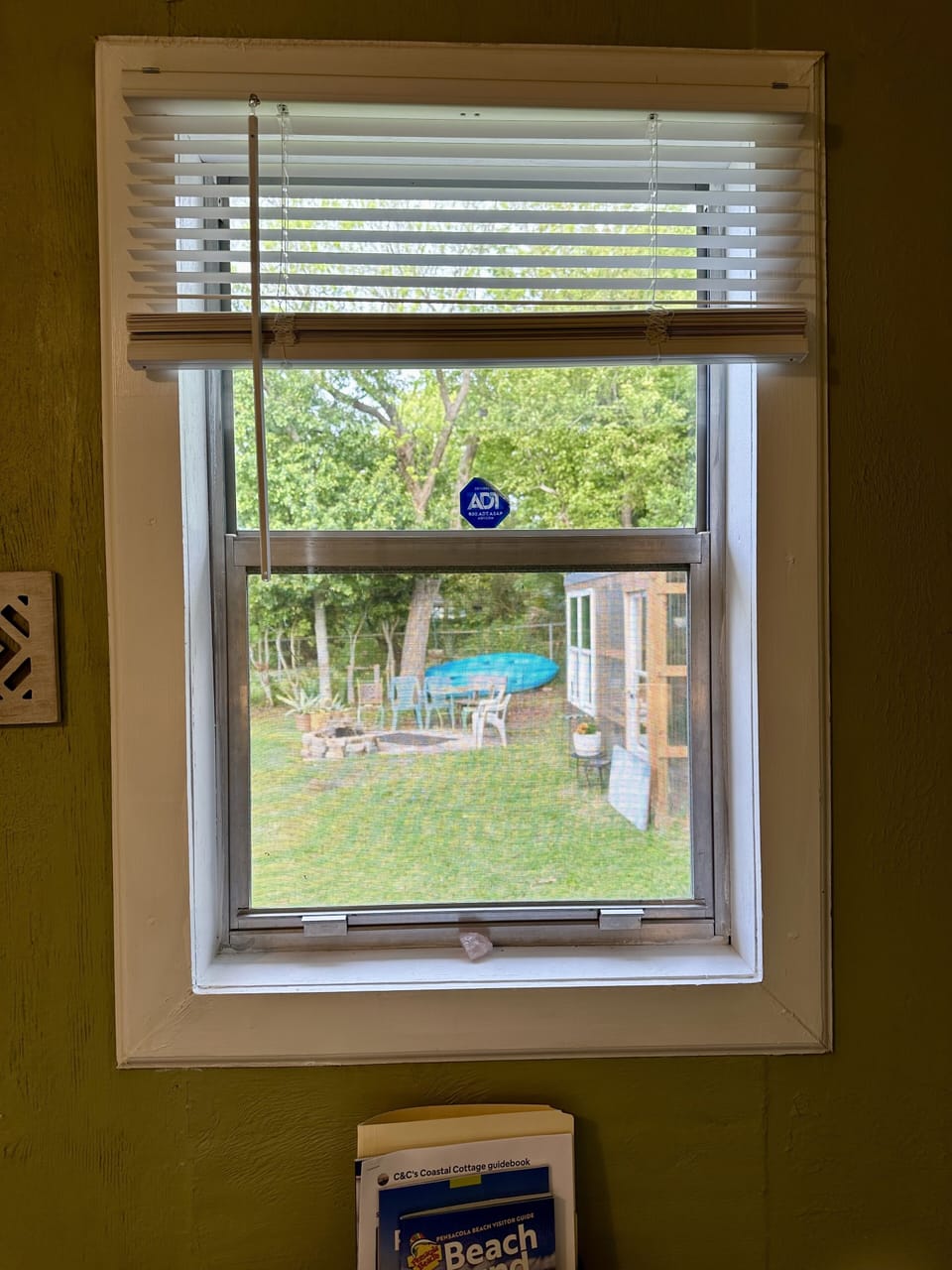 3 windows in BR for ample natural light.  Back yard view from window over desk.