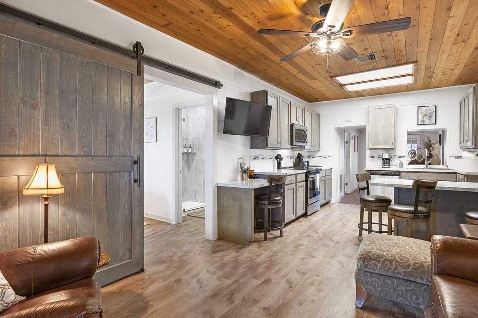 A modern, wide-open floor plan in the living and social spaces here allow for conversation and laughter no matter where you are!