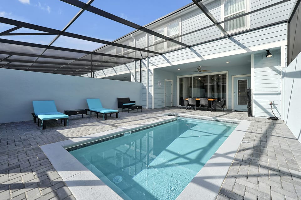 Private heated pool with screened lanai —perfect after park days