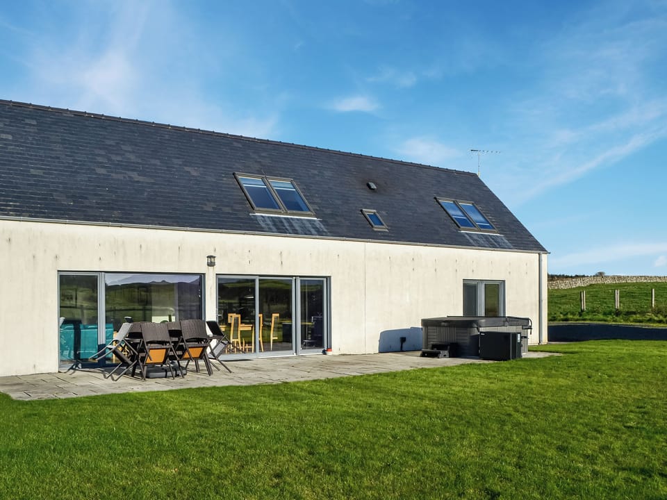 Longhouse garden<br />area with hot tub | The Longhouse at Threave, Castle Douglas