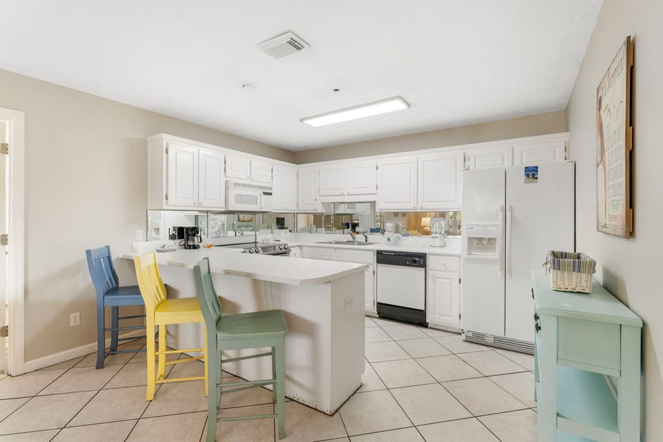 Open inviting kitchen allows you to cook, while conversing with your guests.