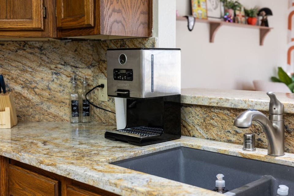Coffee maker and sink.