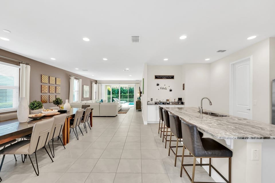 This second bar dining space provides additional seating, perfect for large families or group gatherings.