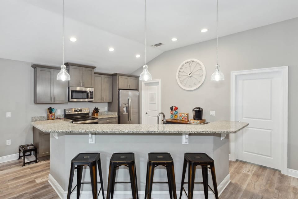 Bar seating for four overlooking the kitchen