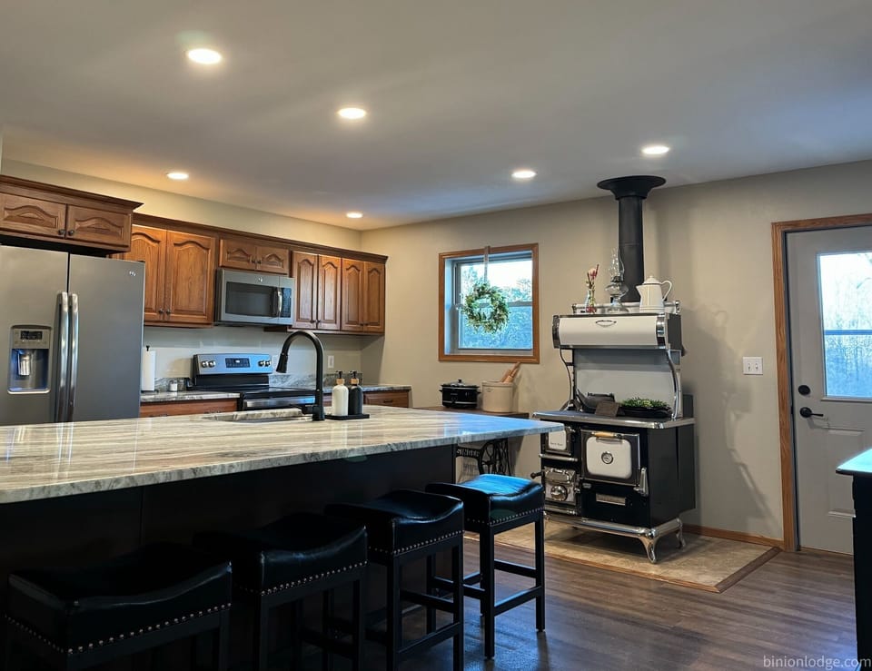 Kitchen - large island and woodstove