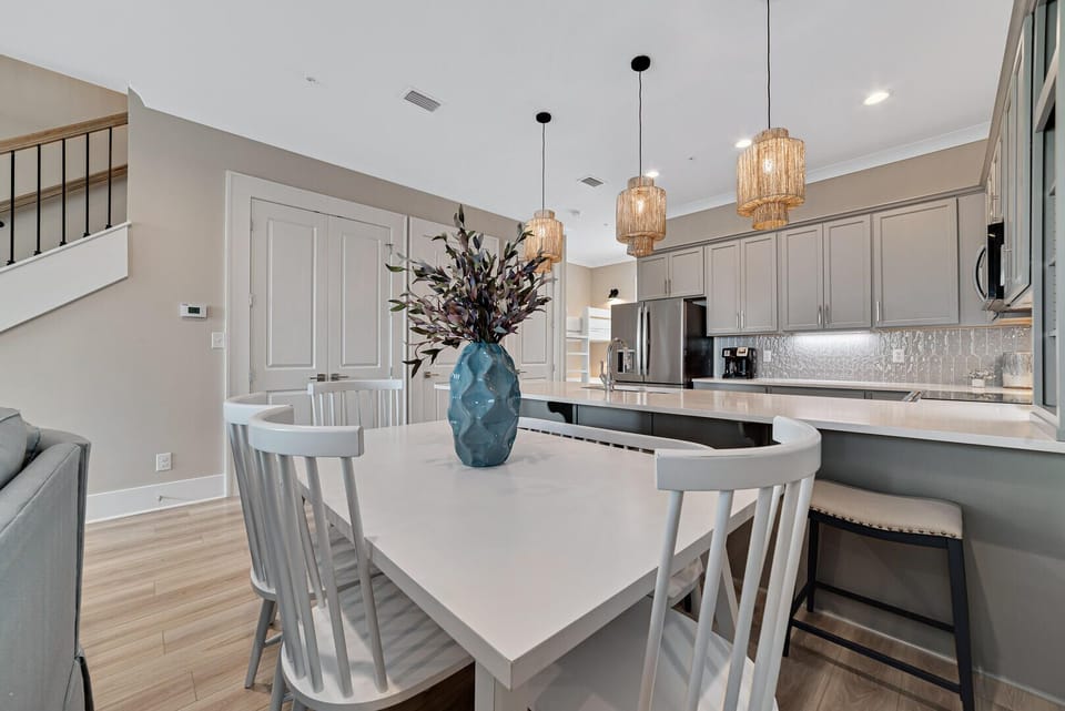 Delight in the pleasure of gathering around the dining table, which comfortably seats six guests, with an additional seating capacity for four at the bar. This setup ensures ample space for a delightful home-cooked meal.
