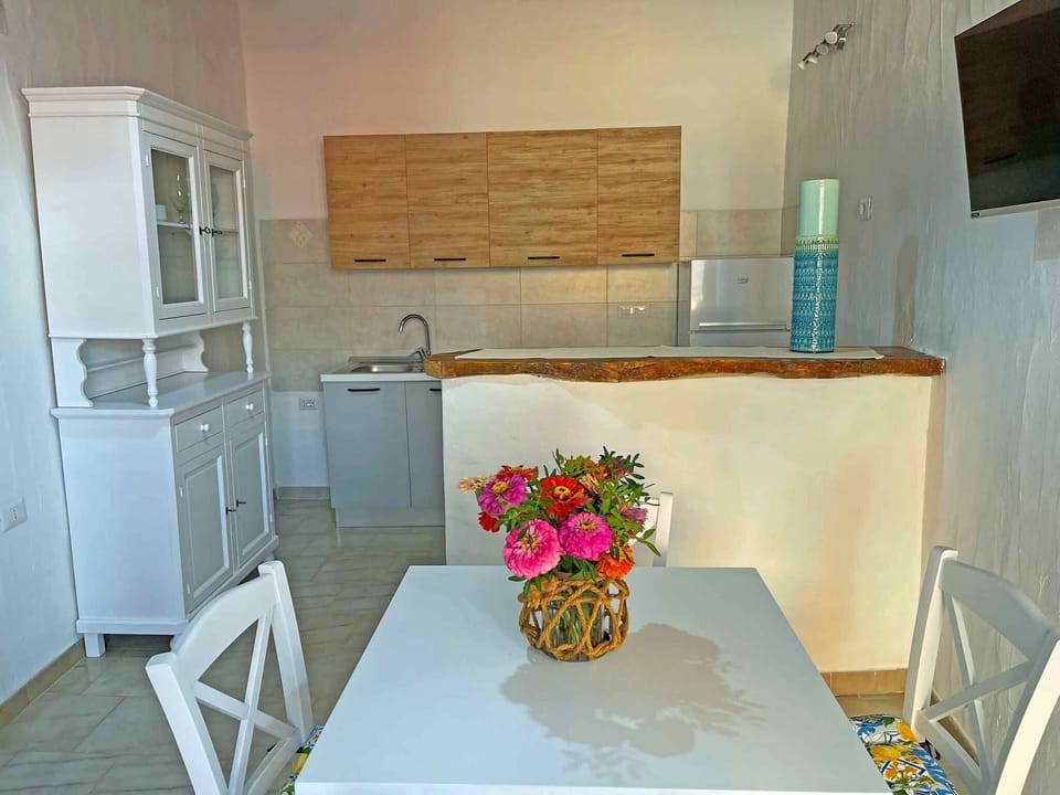 Comfort Apartment | Living area | 32-inch flat-screen TV with cable channels