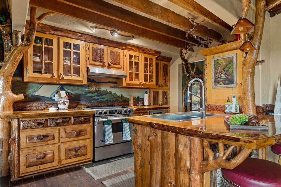 The kitchen features stainless steel appliances and all of the cooking basics during your stay!