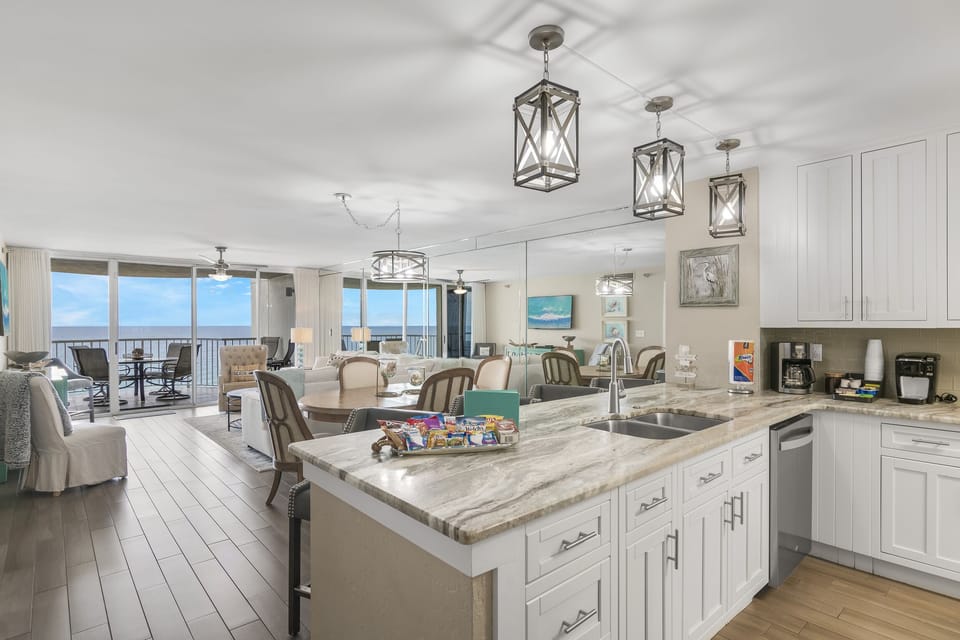 Remodeled Kitchen with granite countertops, stainless appliances - cook delicious meals and dine while overlooking the Gulf of Mexico!