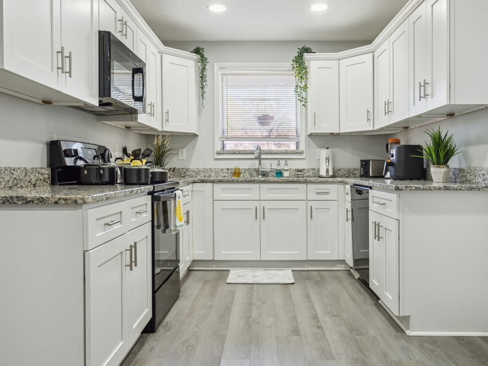 Bright and open fully equipped kitchen where it will be a delight to share meals and moments with family.