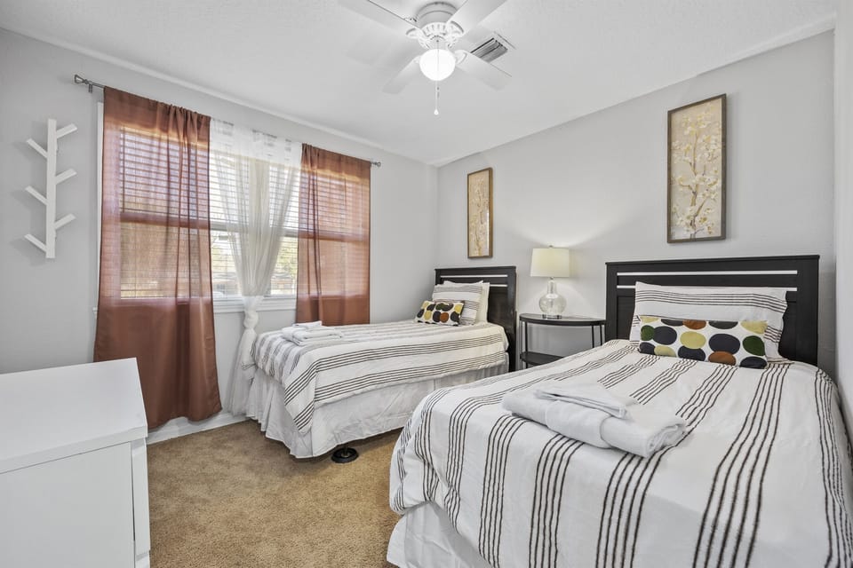 Cozy and comfortable twin beds with everything you need to enjoy your stay.