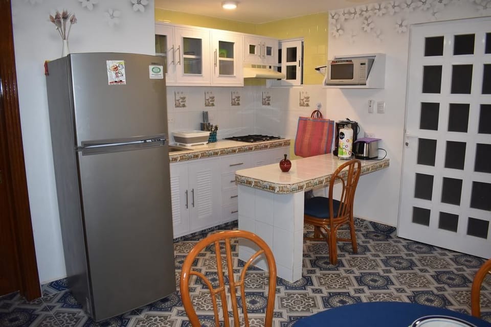 Deluxe Villa, Multiple Bedrooms, Private Bathroom (Fre wi fi ) | Private kitchenette | Full-size fridge, microwave, stovetop, coffee/tea maker