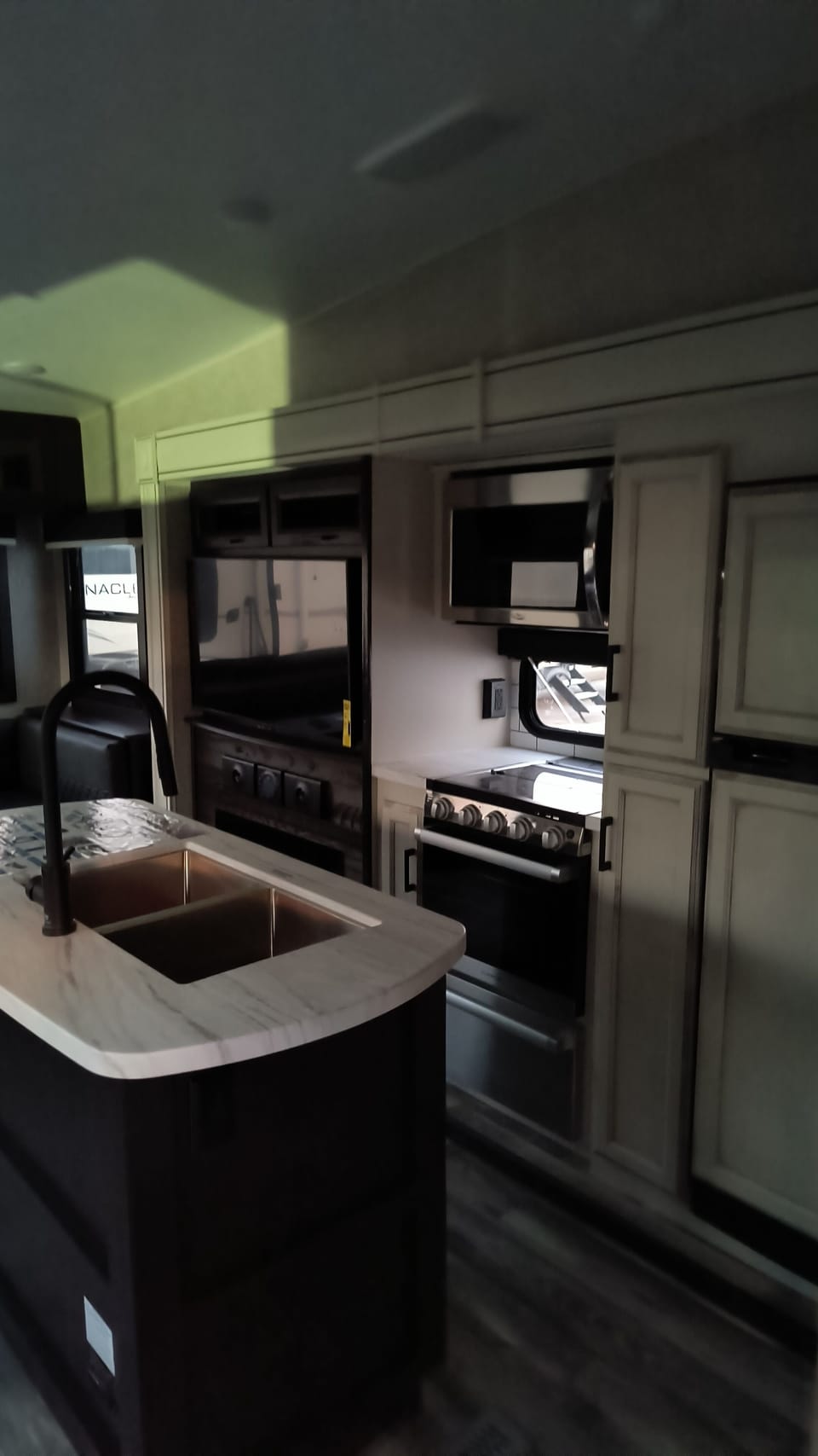 Kitchen has gas stove ,micro, and fridge with freezer.