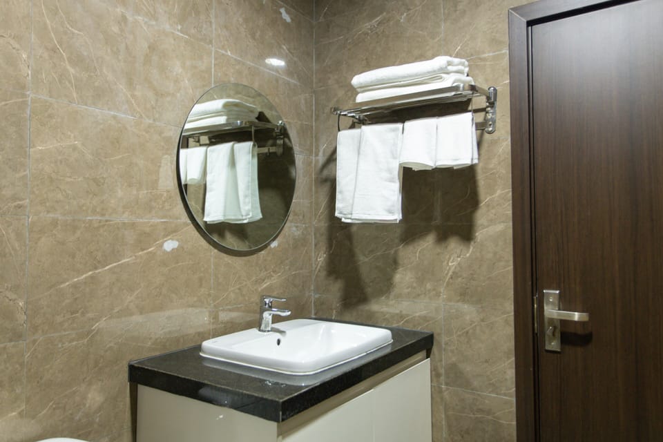 Deluxe Double or Twin Room | Bathroom | Shower, hair dryer, slippers, soap