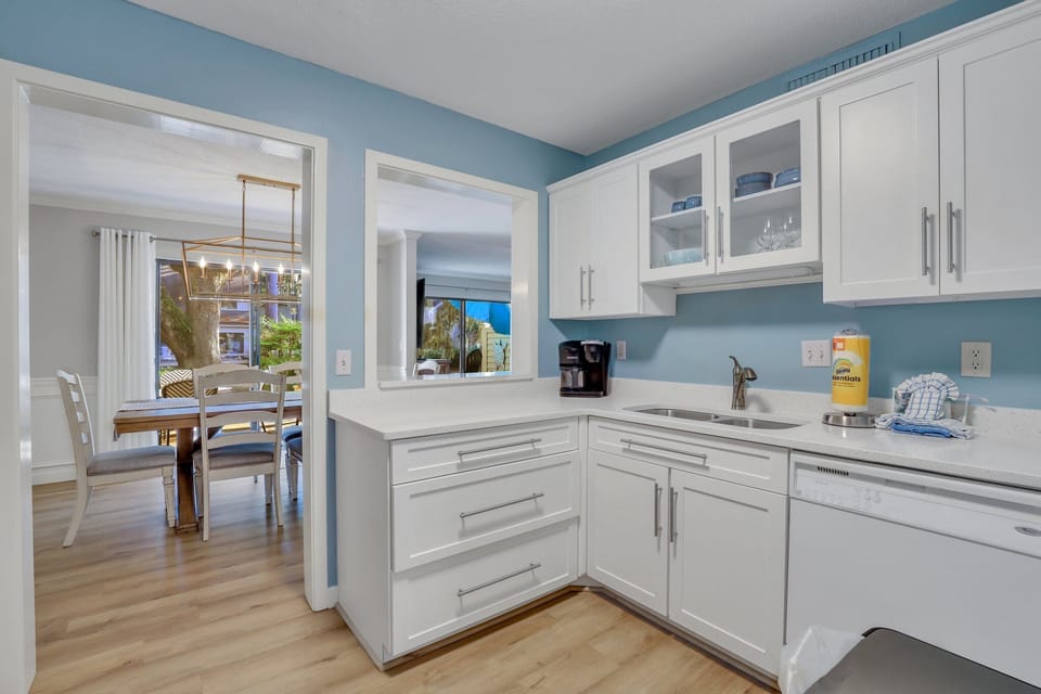 Fully stocked kitchen with stainless steel appliances .