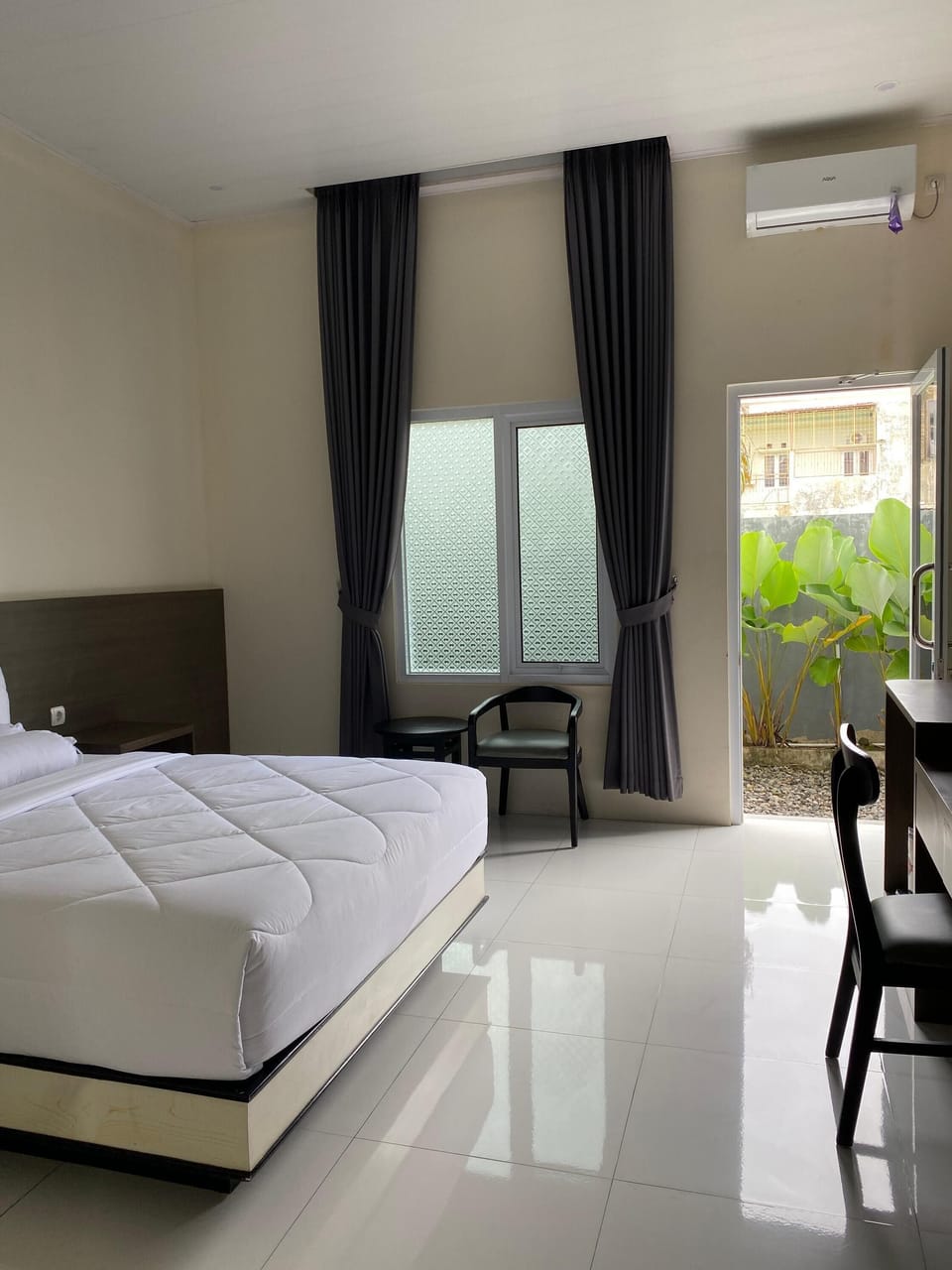 Deluxe Double Room, Garden View | Free minibar, desk, laptop workspace, blackout drapes