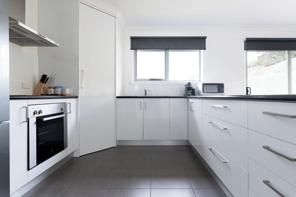 Bright and spacious kitchen with stylish finishes and thoughtful design.