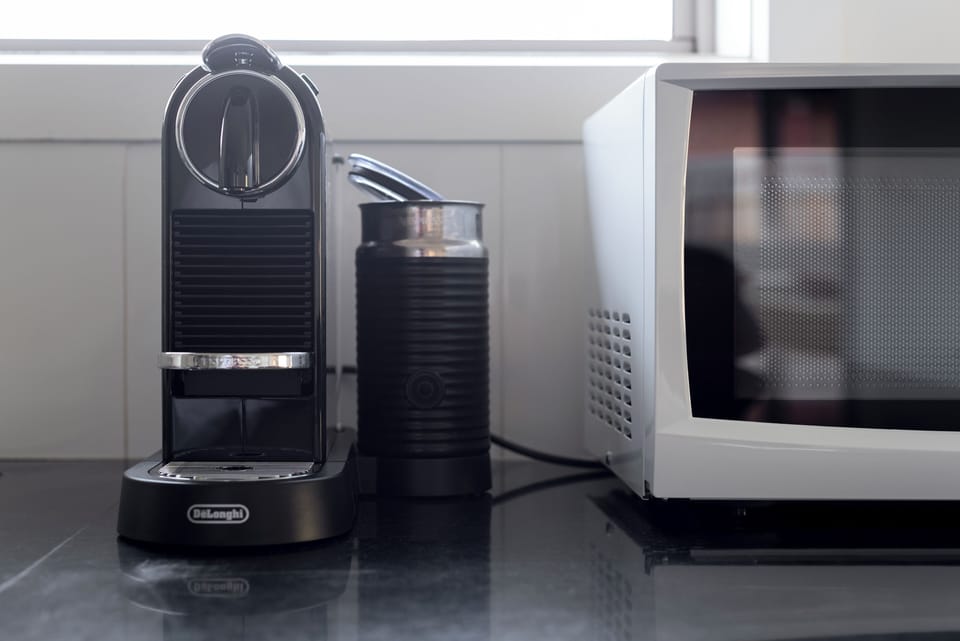 Sleek, high-quality appliances ready for your morning brew and quick meals.