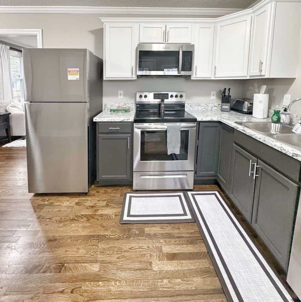 Spacious and modern kitchen with full stainless steel appliances