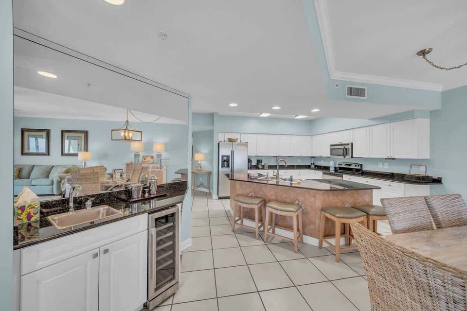 Wet bar off dining area with wine cooler