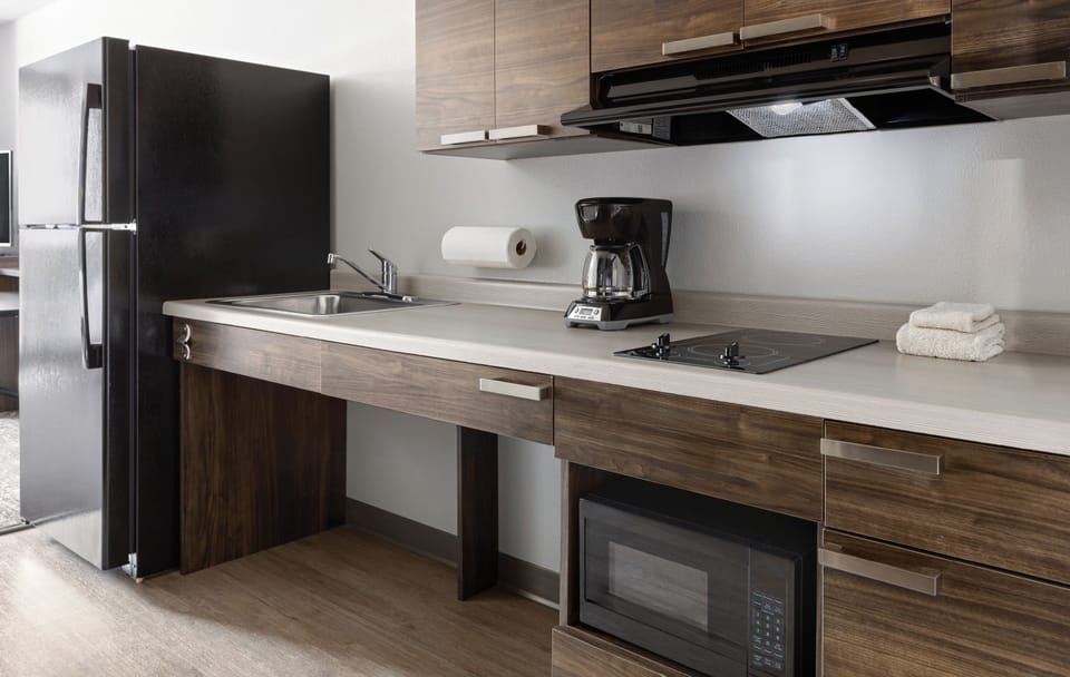 Full-size fridge, microwave, stovetop, coffee/tea maker
