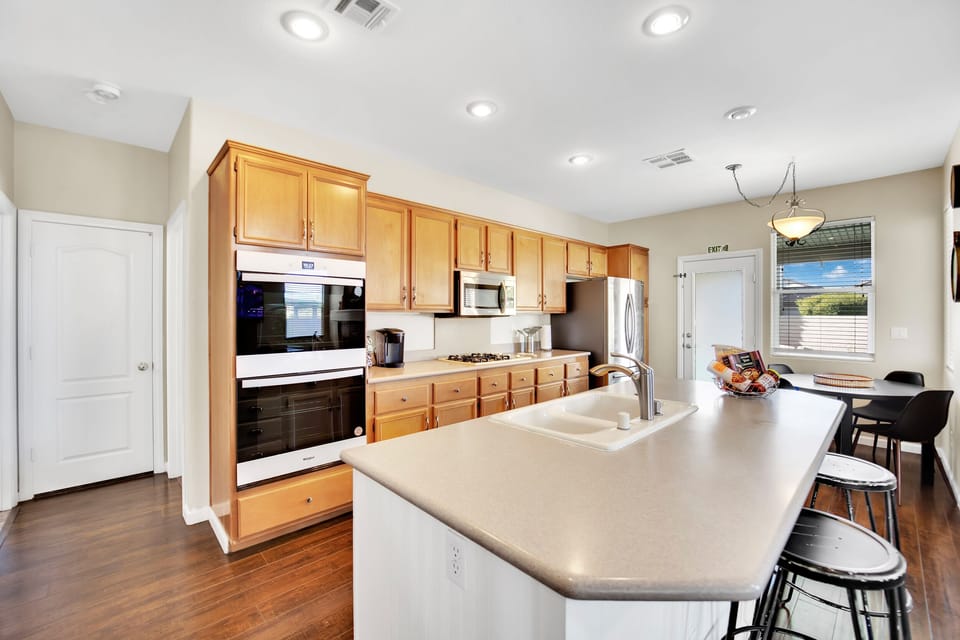 For culinary enthusiasts, the kitchen is a masterpiece, equipped for even the most discerning chefs.