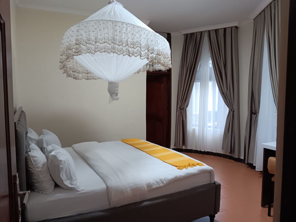 Executive Single Room | Blackout drapes, iron/ironing board (on request), WiFi (free)