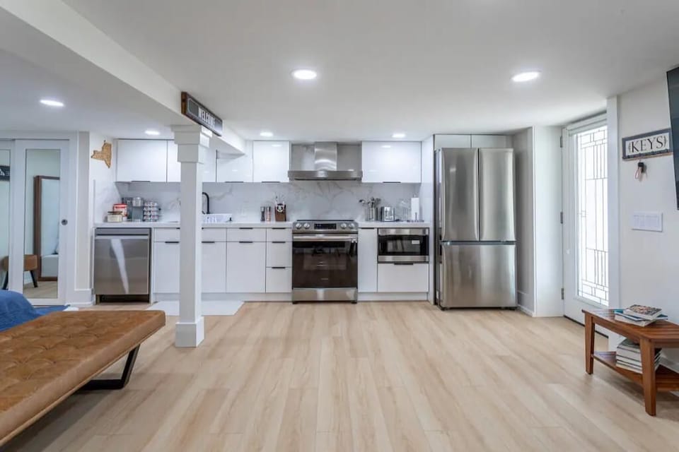 The modern, streamlined kitchen comes fully fitted out with high end appliances 