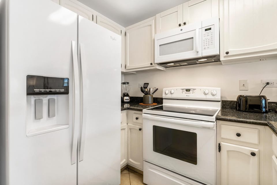 Condo, 1 King Bed (Kona Alii 208) | Private kitchen | Oven, toaster, paper towels