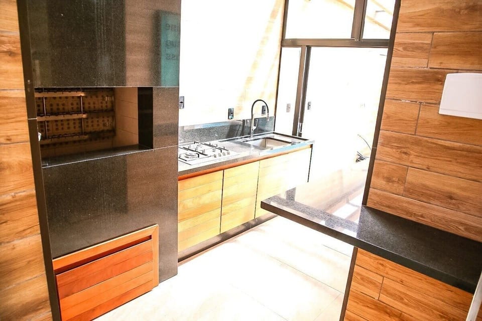 Deluxe Apartment, Pool Access, Beach View | Private kitchen | Fridge, microwave, cookware/dishes/utensils, dining tables