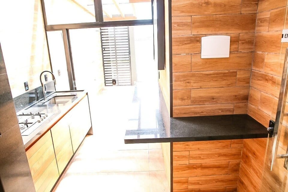 Deluxe Apartment, Pool Access, Beach View | Private kitchen | Fridge, microwave, cookware/dishes/utensils, dining tables